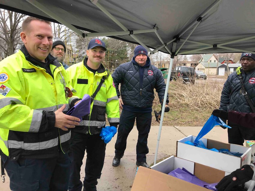 Firefighters from Frogtown&rsquo;s Station 18 lend a hand during the annual Frogtown Park &amp; Farm trash pickup on Earth Day 2023. (Photo submitted)