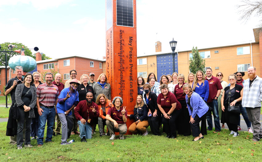University of Minnesota Extension educators from around the state learned about Rondo&rsquo;s history during a tour of the area on Sept. 28, 2023. They posed by the Solar Peace Pole at Western Sculpture Park. (Photo submitted)