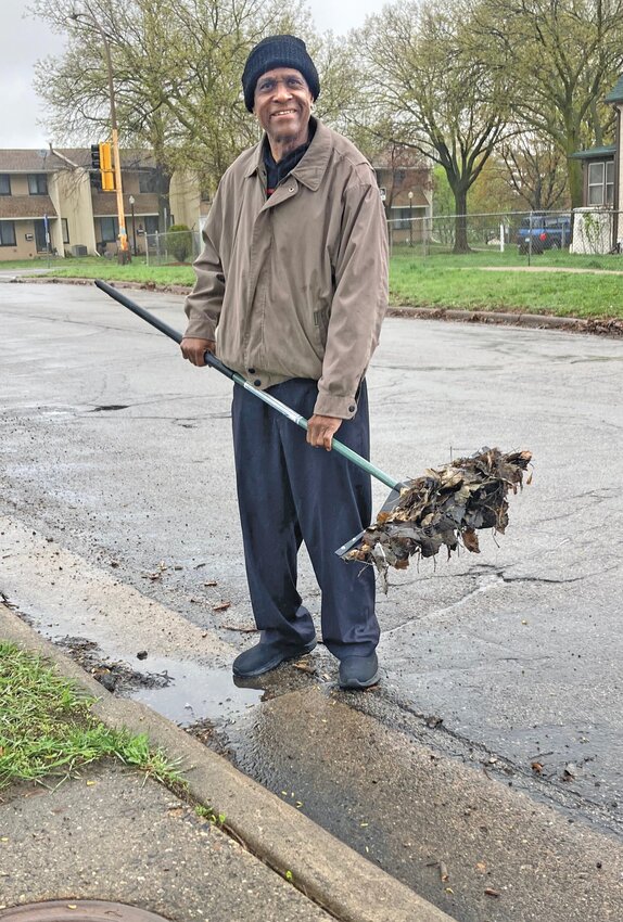 Rennie Gaither doing his &ldquo;adopt-a-drain&rdquo; volunteering. (Photo submitted)