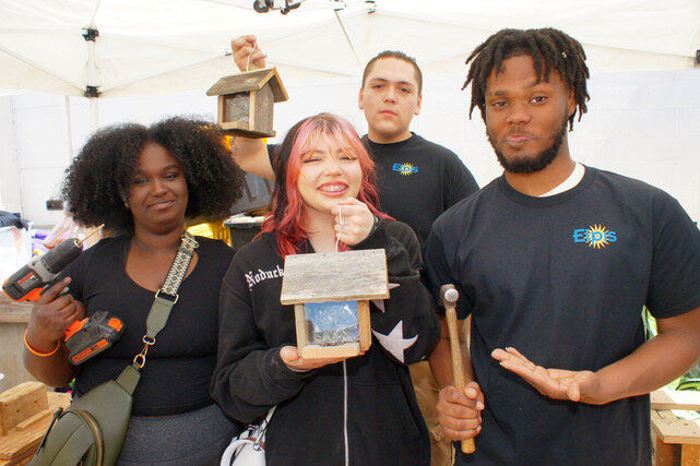 An eager crew of Elpis youth workers demonstrate woodworking. Left to right: Mariyan A. (R) Phoebe B., Jesus M. and Caleb M. Elpis The nonprofit Elpis Enterprises (2161 University Ave.) offers paid internships to homeless youth in screen printing, woodworking and bag manufacturing.