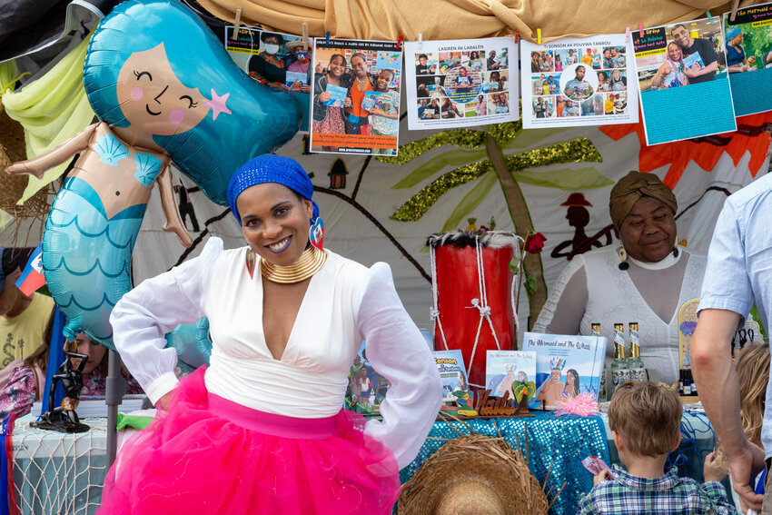 Djenna Saint-Juste was part of the 10th annual Little Africa Festival at Hamline Park on Aug. 4, 2024. Saint-Juste is a Haitian teacher who decided to write her own novels after being inspired by her grandmother and schooling. Books are written in Creole, English, French, and Spanish, and they help children grasp what the book is about if they do not speak the language. The African Economic Development Solutions hosts the annual festival to bring together diverse African immigrant communities. The event celebrates African Minnesotan culture, heritage and community and features live music performances, art shows, and vendors. (Photo by Terbuto Ochothow)