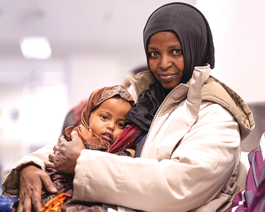 In late 2024, staff and volunteers from the International Institute of Minnesota were part of a reunification at the Minneapolis-Saint Paul International Airport for the Muhamad and Mariam Ibrahim family. (Photo by Alexander Zoltai)