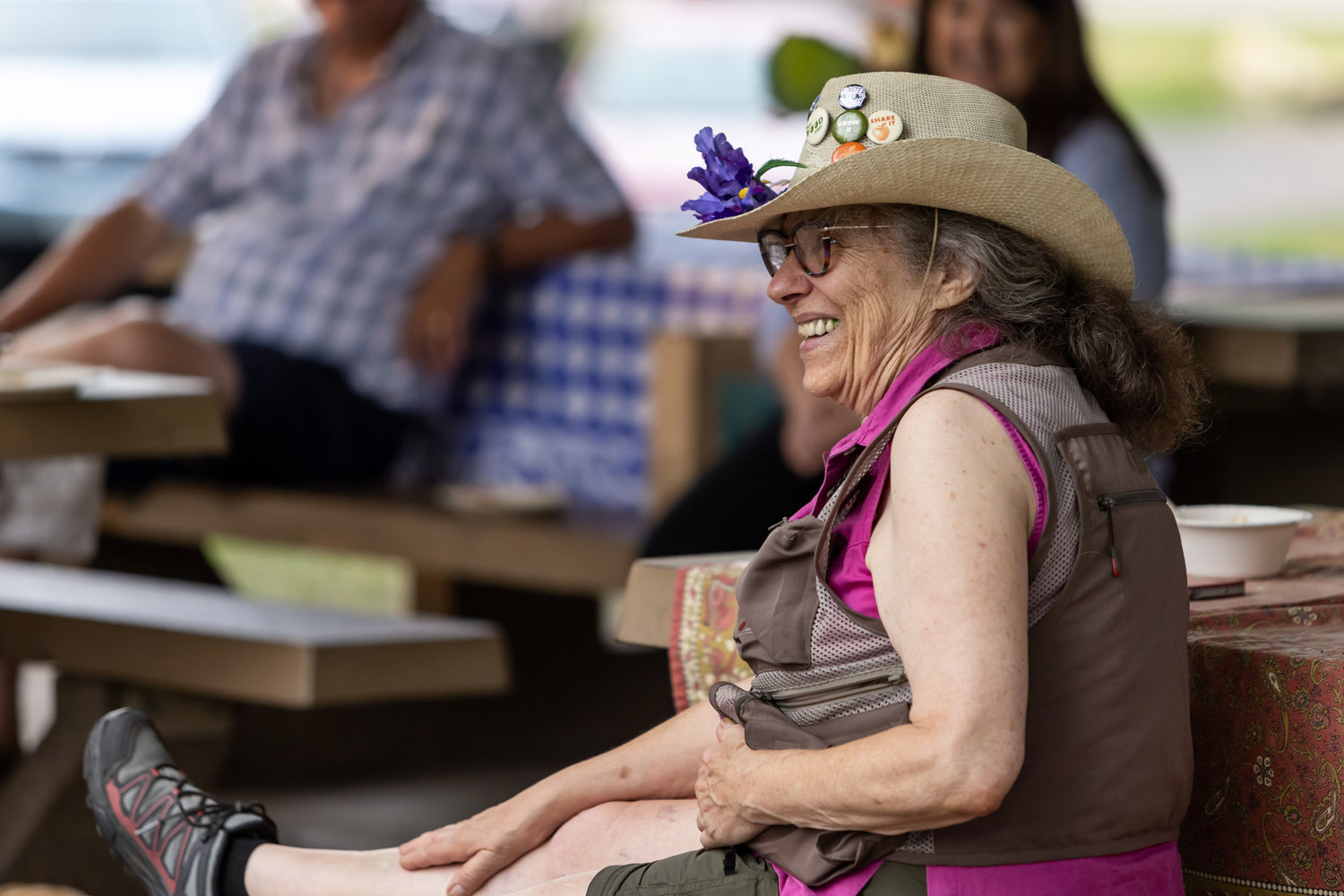 Diane Dodge was roasted and toasted by several dozen friends and admirers at a recent picnic at Newell Park. Best known for her relentless community activism and cheerful, flower-covered hats, Dodge is moving to rural Wisconsin to be closer to family. (Photo by John Pavlica)