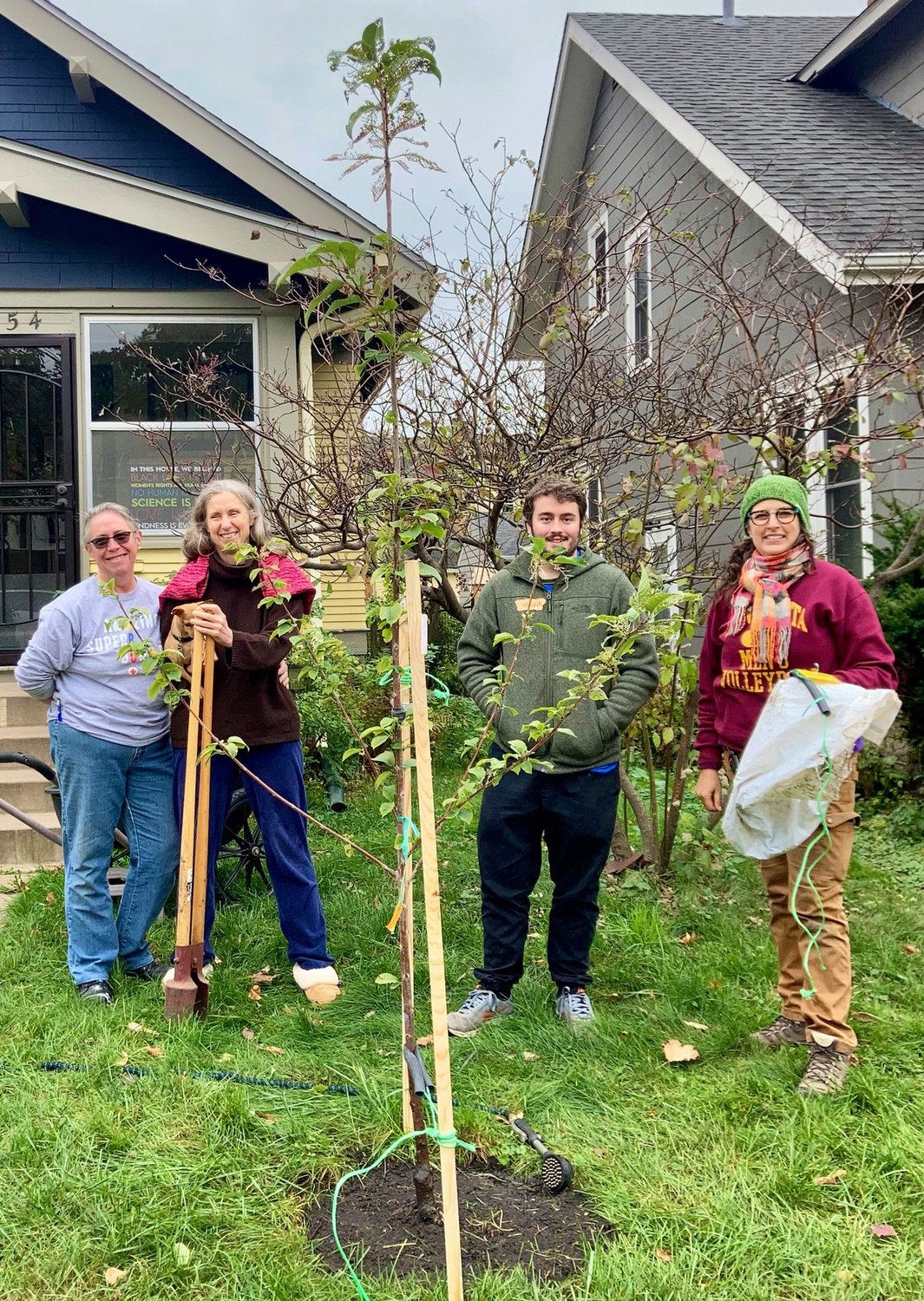 Volunteers plant trees. Left to right: Shari Pleiss, Julia Reed, AmeriCorps Forestry intern Mason Donat, and Environment Committee volunteer Stephanie Hankerson. (Photo submitted)