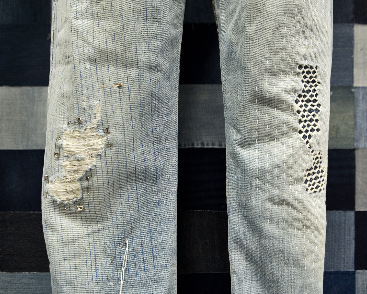 It takes about 2,000 gallons of water to produce one pair of jeans. RETHINK offers Visible Mending classes that will extend the life of a well-loved pair of jeans. Honor the most used part of your jeans (shown at left). Learn to use a running stitch over and over again, and graft the stitches together with visible mending techniques (shown at right). (Photo by Margie O’Loughlin)