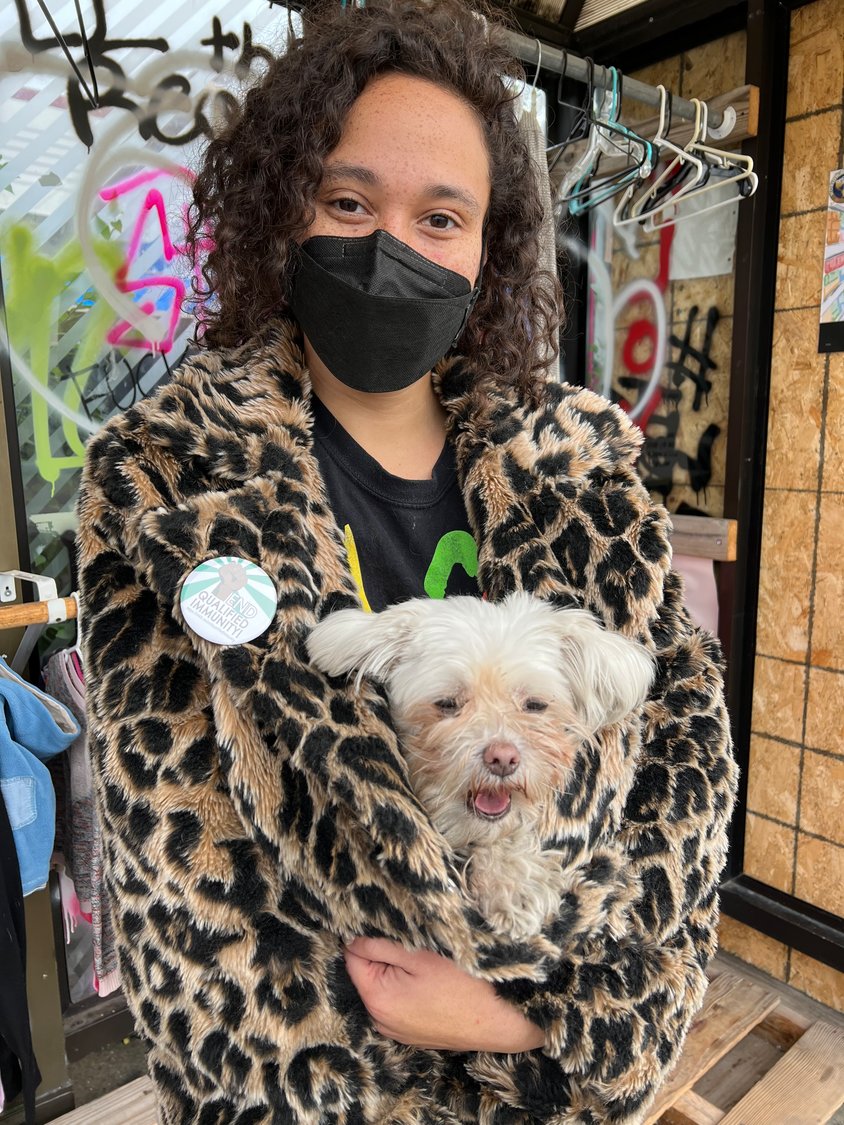 Jennie Leenay, GFS community member and caretaker of The People’s Closet, with their pup Joyoncé. It's important to Leenay that fashion reaches everyday people, and that people feel connected to themselves and their community.  (Photo by Jill Boogren)