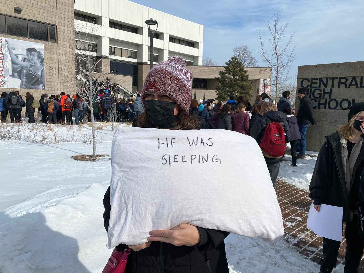 Midway mom of two, Kristine Howatt, held a pillow with the reminder, “He was sleeping” during a rally at Central High School. (Photos by Tesha M. Christensen)
