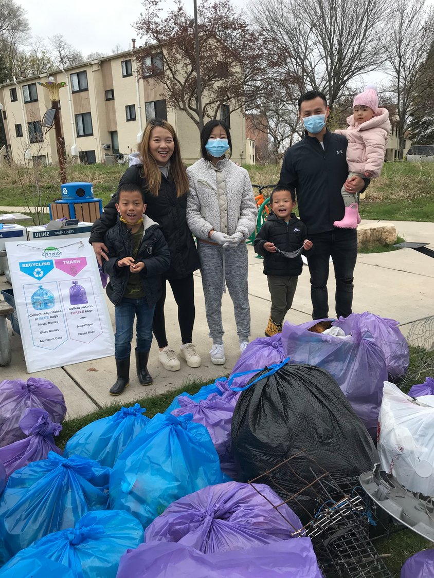 A family group participates in the 2021 parks cleanup event at Frogtown Park & Farm. (Photo courtesy of Frogtown Green)