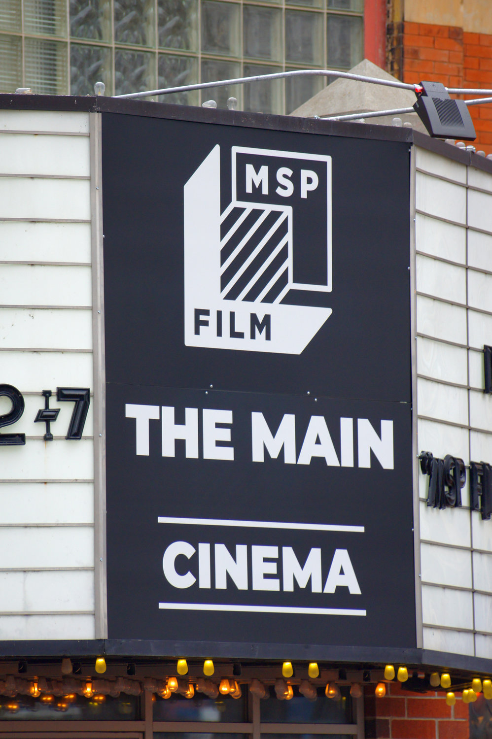 The concessions counter at the theater on 115 SE Main was remodeled. New carpeting was installed on the stair to the second floor, and the second-floor concession stand was removed. The old bulb-illuminated exterior “Main” sign remained, but the marquee below has been remodeled to include the MPS Film Society name. (Photo by Terry Faust)