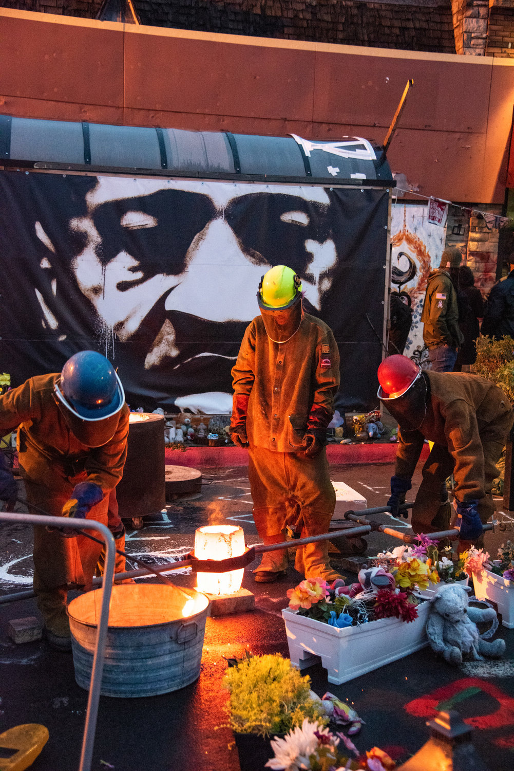 Members of the Chicago Avenue Fire Arts Center do a bronze pour of a sankofa bird on the 2nd angelversary of George Floyd’s death, May 25, 2022.