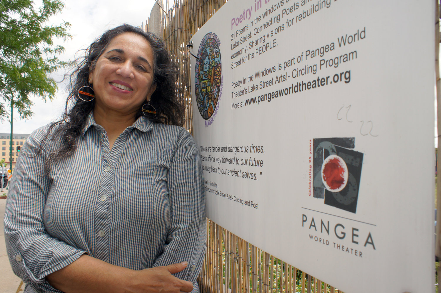 Meena Natarajan stands at the future site for the Pangea Theater on the 27th Ave. block between Lake and 31st Street. (Photo by Terry Faust)