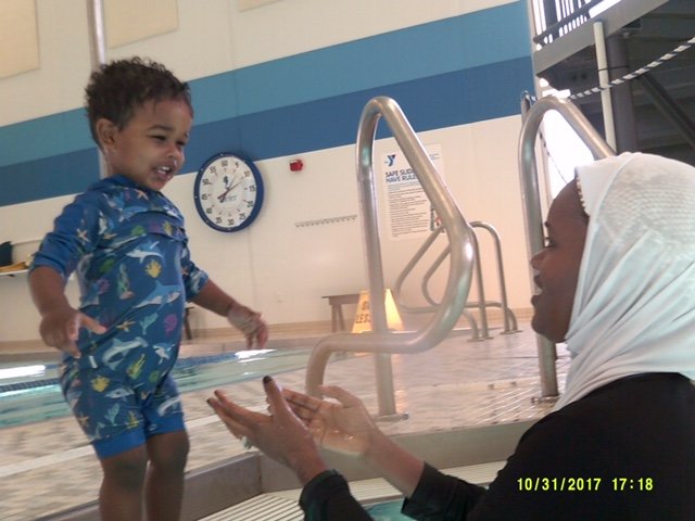 Little Jibril can now swim the length of the recreational pool at the Midway YMCA on Saturday mornings. (Photo by Mitchell Lallier)