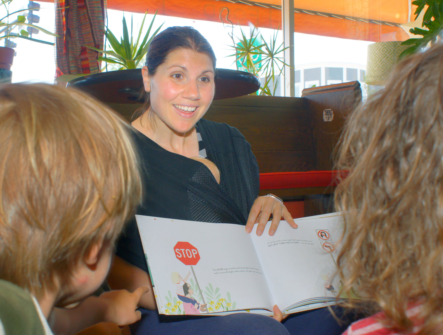 Ioana Stoian presents her new book, “Begin One Way: A Children’s Book of Road Signs at the Gingko Coffee Shop on June 18. When five-year-old son George (aka Biff) was 2.5-years-old, he was curious about traffic signs. Ioana and he went to the Hamline Library and found the only books on traffic signs were published in the 1980s and not very interesting. (Photo by Terry Faust)