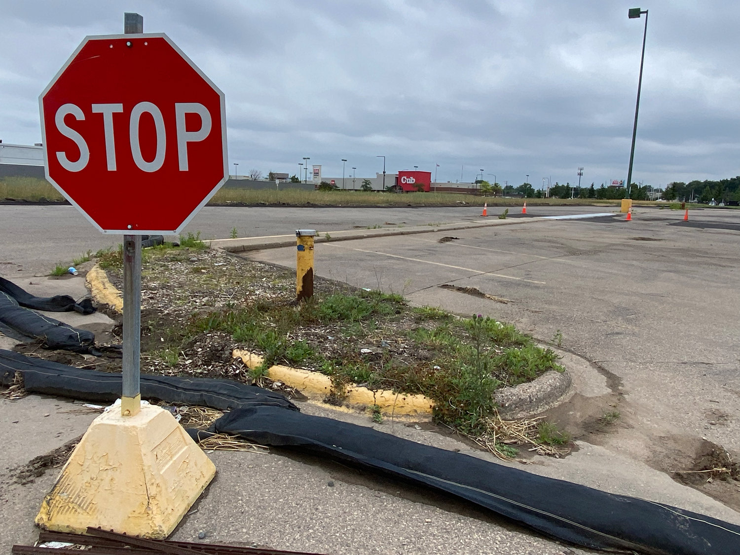 The parking lot of the former Midway Shopping Center, July 2022. (Photo by Tesha M. Christensen)