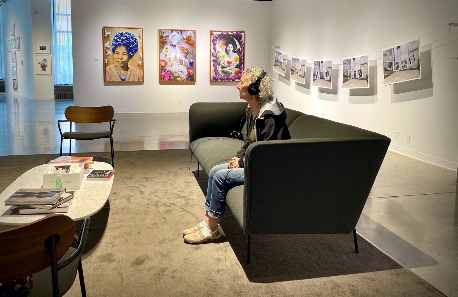 St. Paul resident, Robin Warshaw, enjoys the soundscape of "A Picture Gallery of the Soul" exhibit at the Katherine E. Nash Gallery on the University of Minnesota Campus West Bank. It runs through Dec. 10 and is free. (Photo by Susan Schaefer)