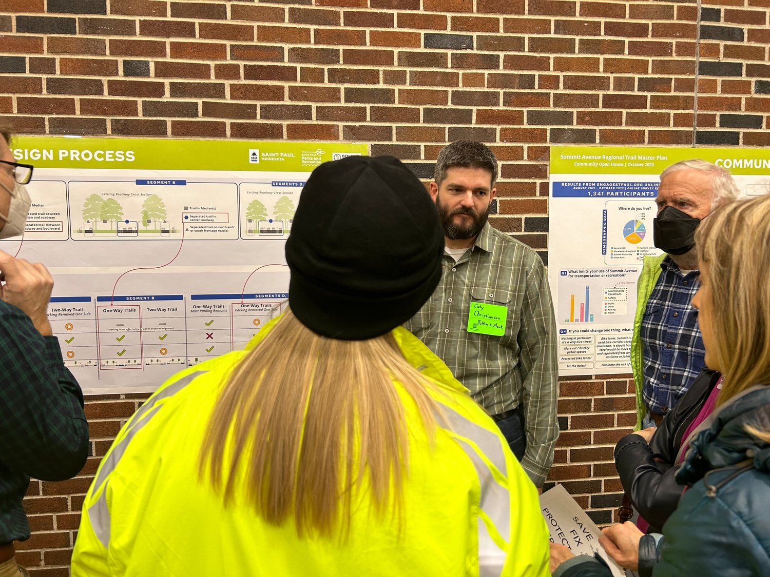 Cody Christianson answers attendees' questions about the design process of the various bike lanes. They aim to enhance safety but also keep parking, pedestrians, and cars in mind. (Photo by Chloe Peter)