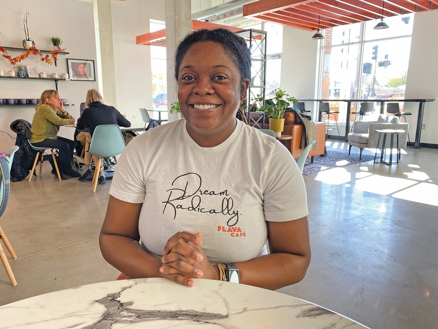 Shaunie Grisby hopes to create a place like The Den from the television series “Moesha”– a place that is a community hangout. Flava Coffee and Cafe at 623 University Ave. West serves beverages, breakfast and lunch. “I wanted to create a space like that where people loved being,” said Grisby. (Photo by Tesha M. Christensen)