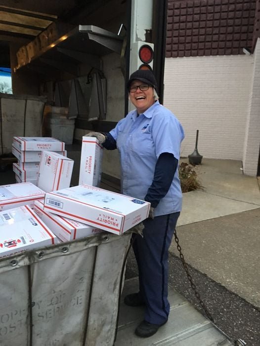 Postal carrier Kendra Hill collects packages full of truffles from Chocolat Céleste.