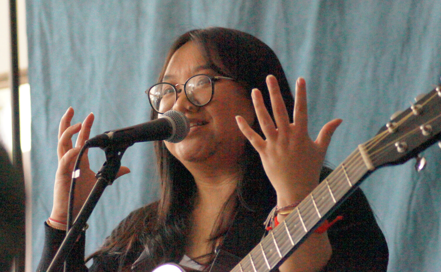 Alicia Thao helps host a recent open-mic night at In Progress. Last year’s events featured just local performers. This year, vendors are a part of the evening in an effort to support local businesses, as well as artists.