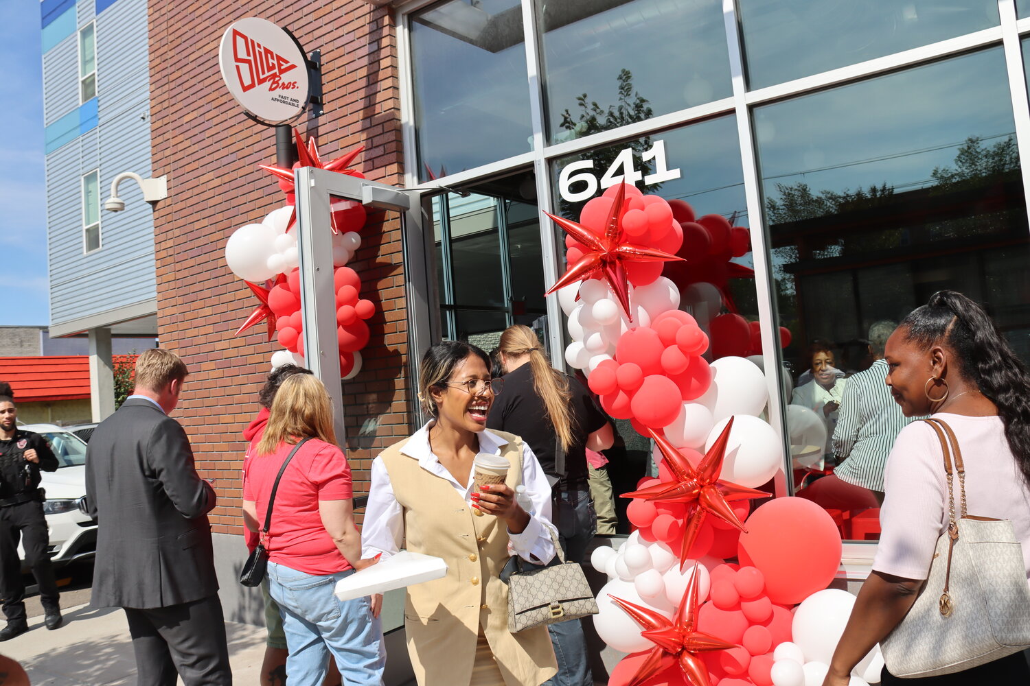 Slice Pizza at 641 University Ave. was packed for the ribbon-cutting on Sept. 15, 2023. (Photo by Tesha M. Christensen)
