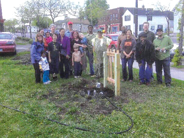 The first of 1,000! Tree Frogs celebrate their initial tree planting in 2011. Then-city councilmember Melvin Carter is in the center of the group.