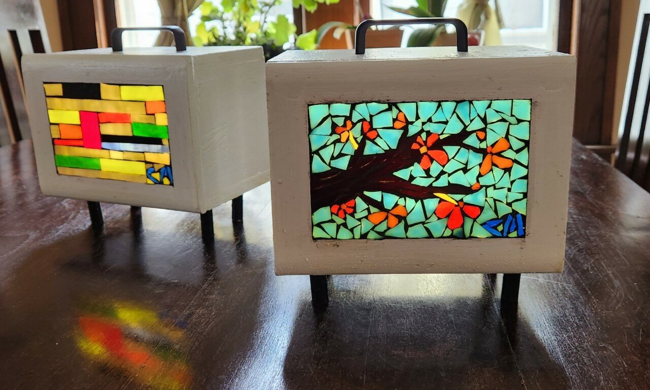 These small lightboxes made by Longfellow artist Chris Miller can brighten tables and shelves. Other larger ones function as furniture. (Photo submitted)