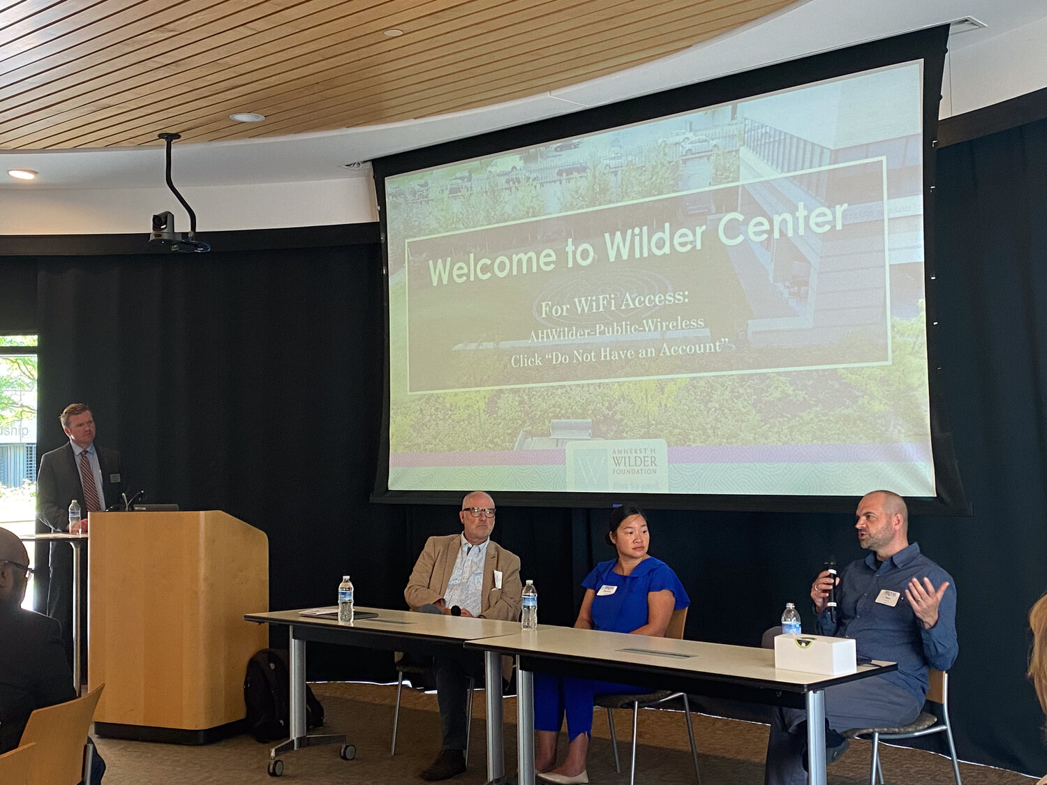 Representatives from local businesses, (left to right) Andrew Eklund of Ciceron, Michelle Tran Maryns of We Sparkle and Ron Lancaster of Structural, chat about the pros and cons of artificial intelligence on Sept. 20. The event was organized by the Midway Chamber and held at the Wilder Foundation.
