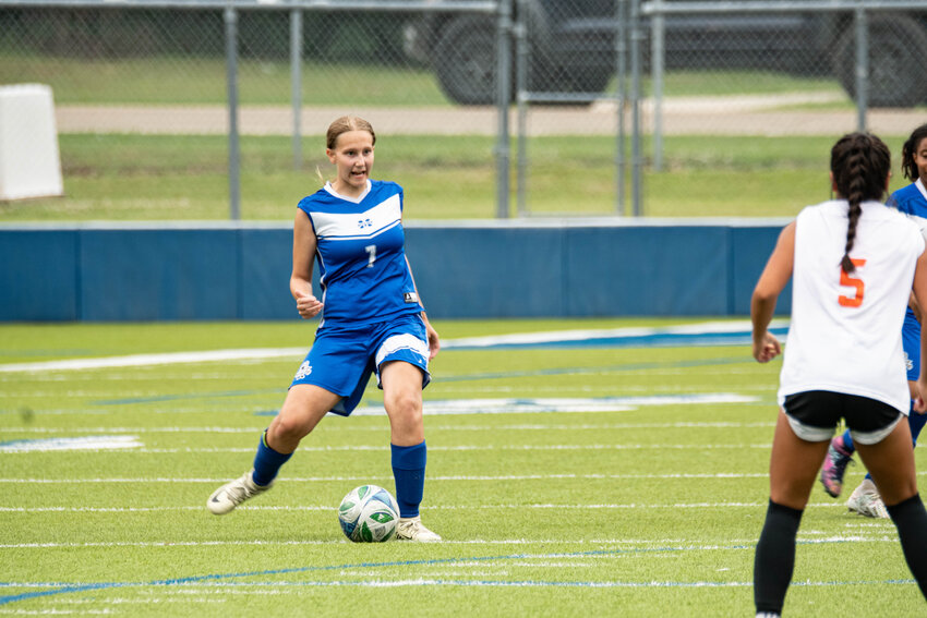 MARY BATES looks to  the ball in the Lady Billies contest against Warren. The Lady Billies will travel to Maumelle on Thursday for a 9 am contest in the 4A State Soccer Championship Tournament. The Lady Billie will enter as the number one seed in the 4A East and will face fourth seed, Magnolia from the 4A South.