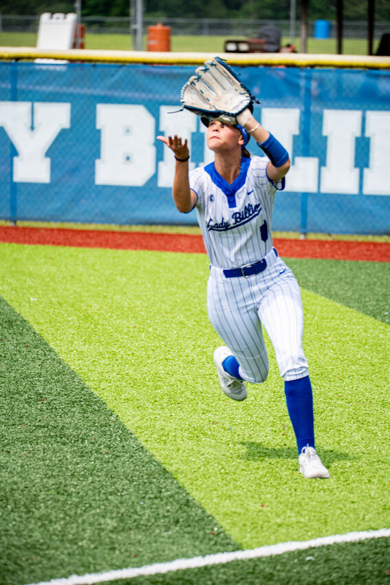 ASHLYNN SNOW sprints to make a catch to end the top of the second inning in Thursday’s first round game against Prairie Grove.