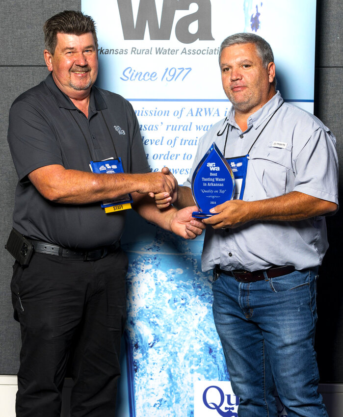 Terry Fortenberry (left) from the Arkansas Rural Water Association presents Jody Hibbard, Yorktown Water Manager, with the Best Tasting Water in Arkansas Award.