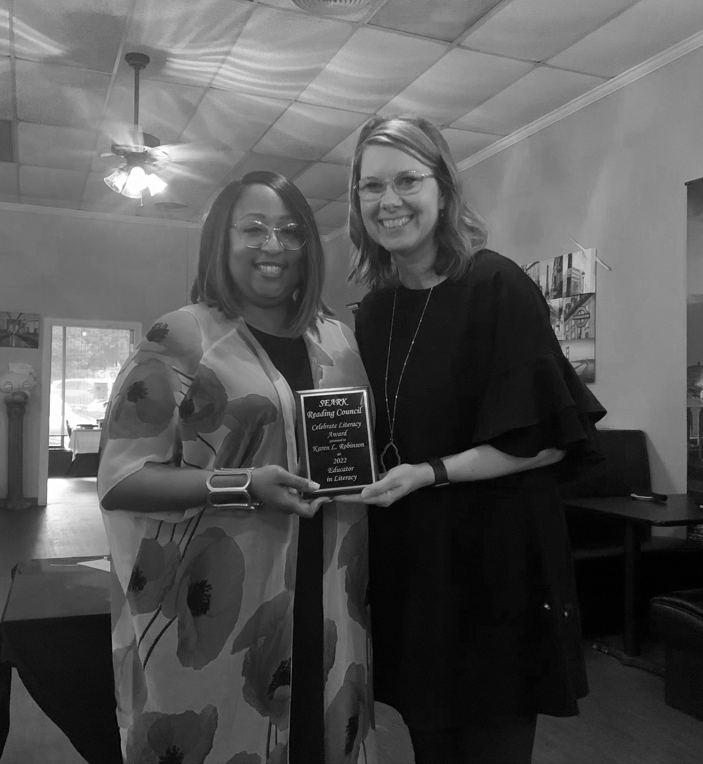 SEARK Reading Council Vice President Latanza Atkins, (left) presents the Educator in Literacy award to Karen Robinson (right) at the recent Celebrate Literacy Meeting.