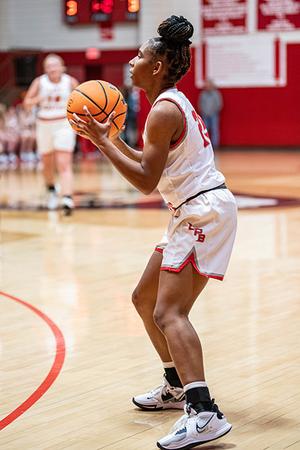 EDRIANA HUNTER looks to take a three-point shot against Crossett on Tuesday night. Hunter would scor six points in the contest.