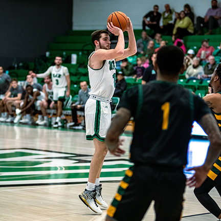 JOSH DENTON takes a jumor shot against Arkansas Tech. Denton scored 13 points against Tech to co-lead in scoring with Jackson. Denton scored 10 points against East Central, three against Southeastern, 16 at Henderson State, and six against SAU.