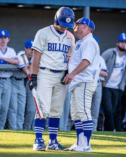 SCOTT JOHNSON, head coach for the Billies, gives instuctions to his batter, Jon Luke Brothertonn, during a called time by Star City.