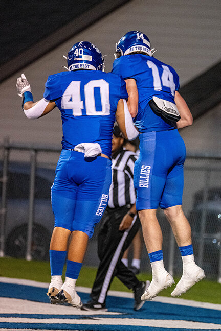BLAINE HAYDEN (14) and JON LUKE BROTHERTON (40) celebrate Hayden’s five yard touchdown pass from Brooks Bowman to put the Billies up 21-0 in the first quarter.