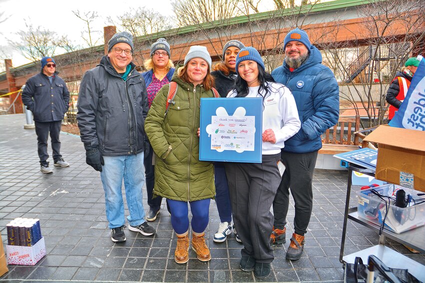 Kelly Pasquarella (second from right), YMCA Director of Resource Development, and Pete Pasquarella, YWCA Shared Housing Coordinator, (far right) stand with YWCA board volunteers (from left) Jerel Wohl, Seema Kazmi, Maureen Bell and Habeeba Laguins during the Doylestown walk.