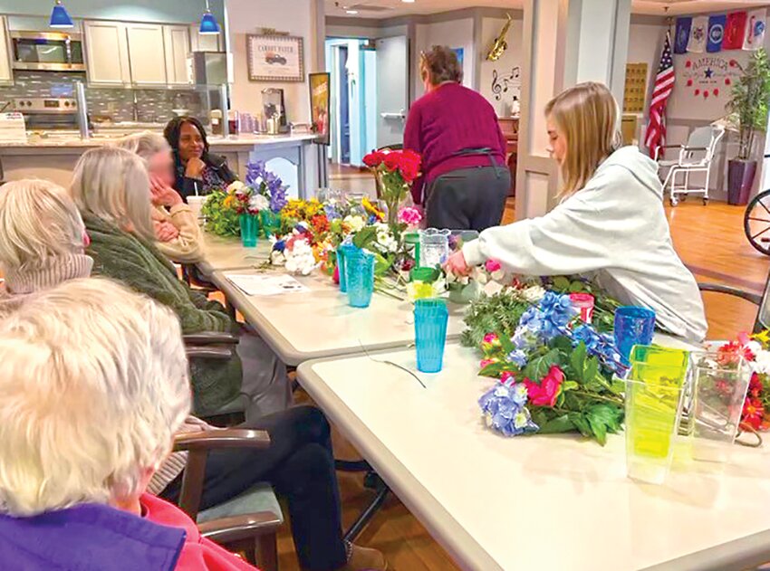Bringing Generations Together! 5th grader Charlotte Carver from Quarry Hill Elementary School joined our  residents for a joyful afternoon of flower arranging—spreading smiles, creativity, and spring cheer one  bloom at a time