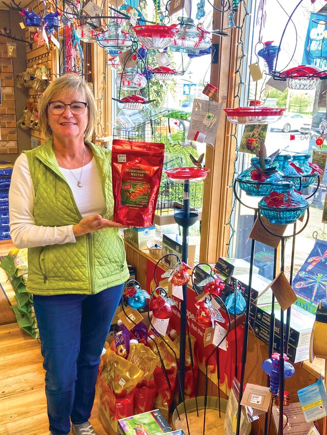 Lisa Mergen with Hummingbird Feeders in full display at Wild Birds Unlimited, Buckingham
