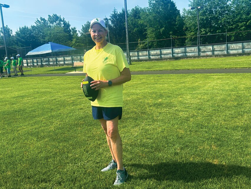 Pat Haneman participates in the football toss competition.