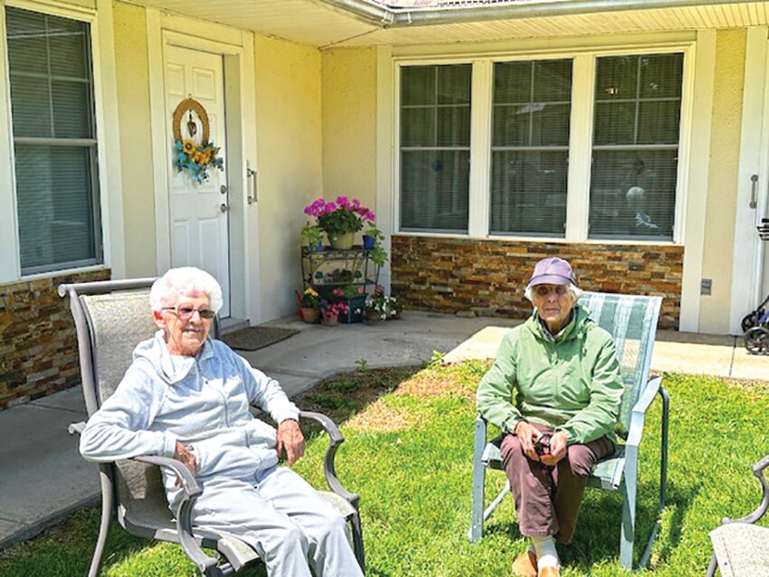 Residents Lily and Margaret enjoying the sunshine together.
