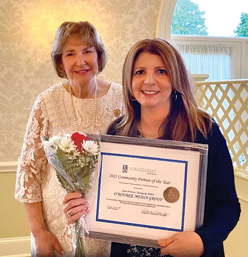 Deanna Bembury accepts the Ginny Cooper Live Your Dream Grant from Diane Smith, past SIIR president.