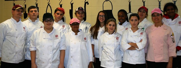 Chef Bill Walker, Chef Erin Carrera and Chef Nancy Sepe standing with their Culinary Arts Students, Class of 2020
