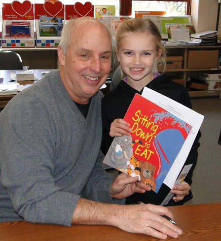 Bill Harley autographs a book for Maddie Coyne!