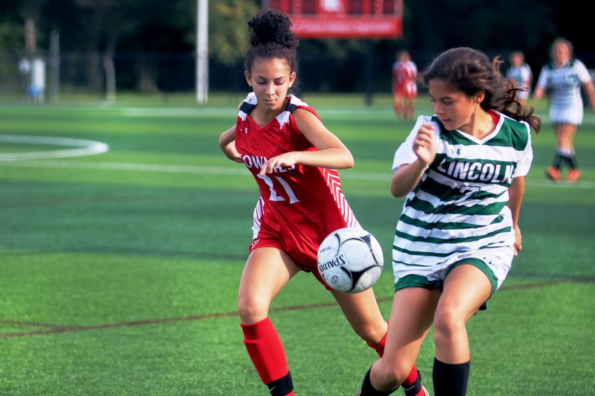 Townies Ashley Cassino- Henriquez trys to get control of the ball vs Lincoln School.
