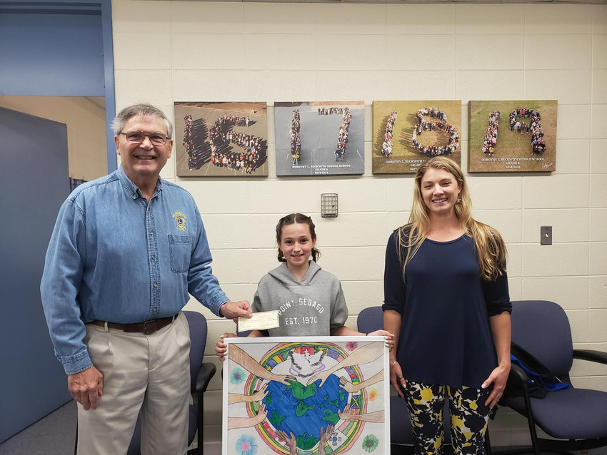 Miss Faletra with Ray Medeiros of the Rehoboth Lions who presented Julia with her framed winner poster and a prize.