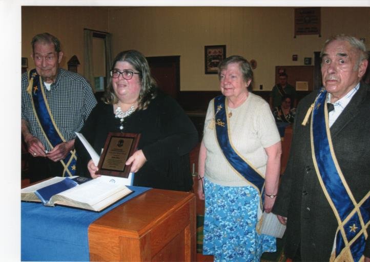Julie Silva, second at left, being presented with the award.  Others shown in photo are at left John Lawson Jr., Shirley Lawson and at right Frank Moitozo, Master of Roger Williams-Rumford Grange.