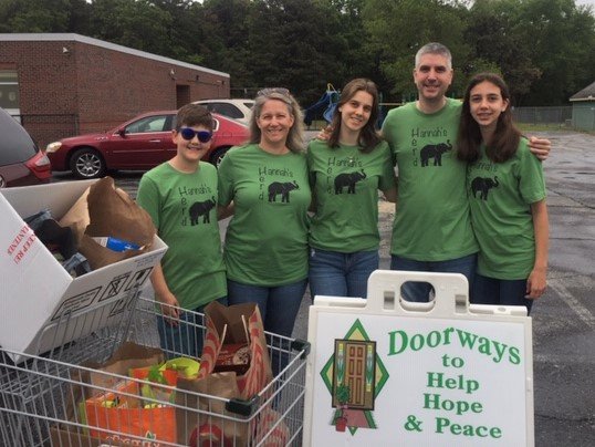 Members of the Baldassi family dropped off food collected for Doorways food pantry in connection with daughter Hannah&rsquo;s 5K run event.