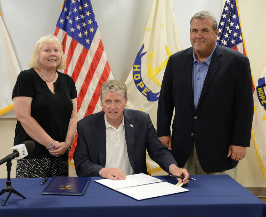 Sen. Valarie J. Lawson, Governor Daniel McKee and Rep. Gregg Amore at the ceremonial bill signing held on July 22.