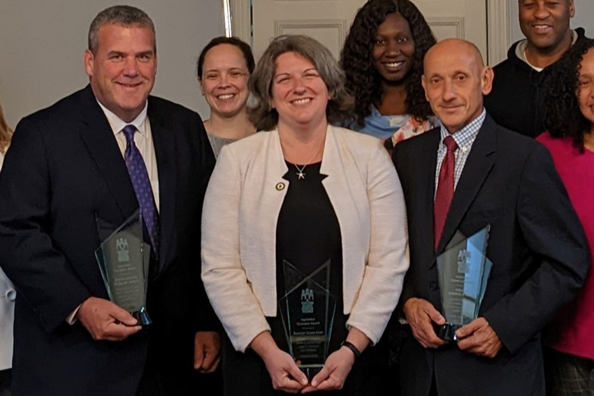 From left, Rep. Gregg Amore, Sen. Dawn Euer and Sen. Louis DiPalma receive the legislative award from the Rhode Island Coalition Against Domestic Violence.