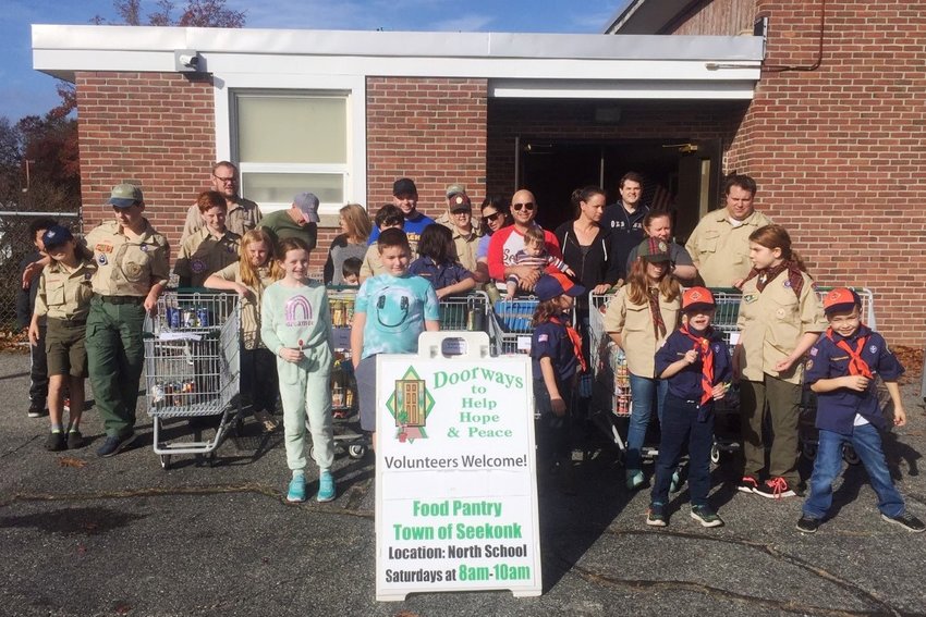 Scouts and parents from BSA Troops 1 &amp; 9, and Cub Scout Pack 88, worked hard to collect over 8,000 pounds of food for Doorways Food Pantry to supplement holiday tables.